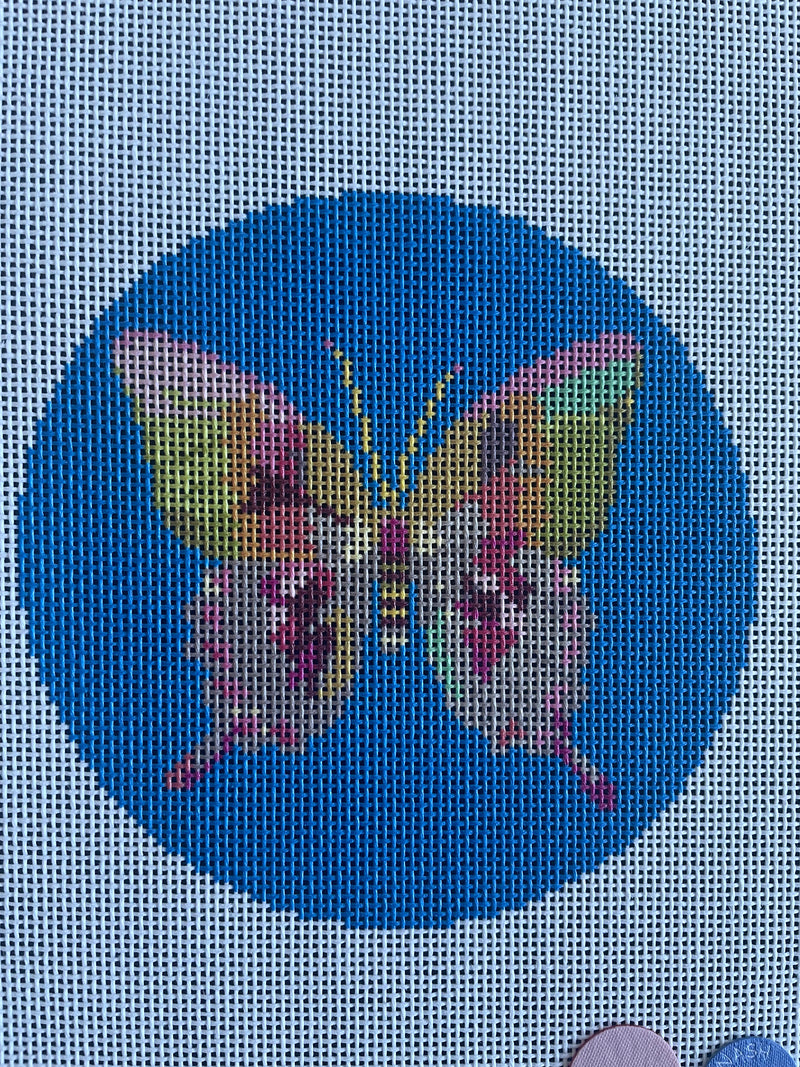 Gold and Green Butterfly on Blue