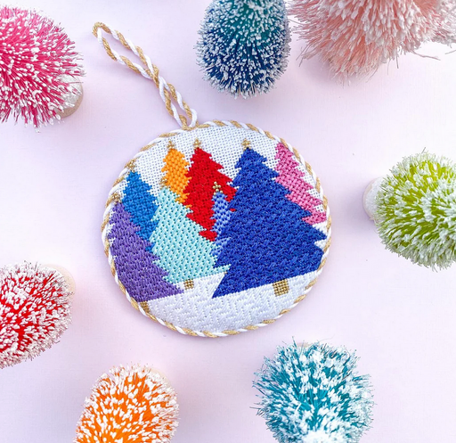 A mid century modern inspired needlepoint ornament by of a bird's head and  stones featuring colors from this era and an easy to stitch design for a  beginner craft project. – Needlepoint